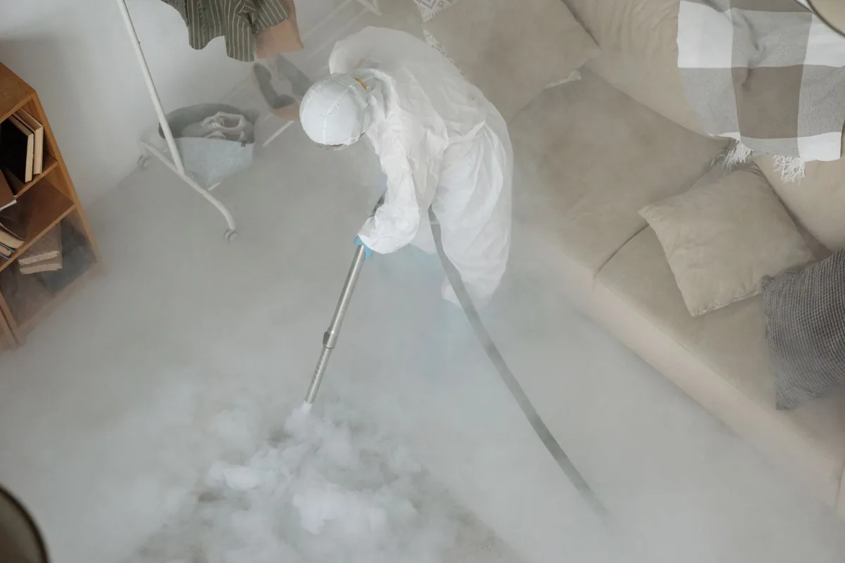 Biohazard cleanup technician in protective equipment, Farmington, ME